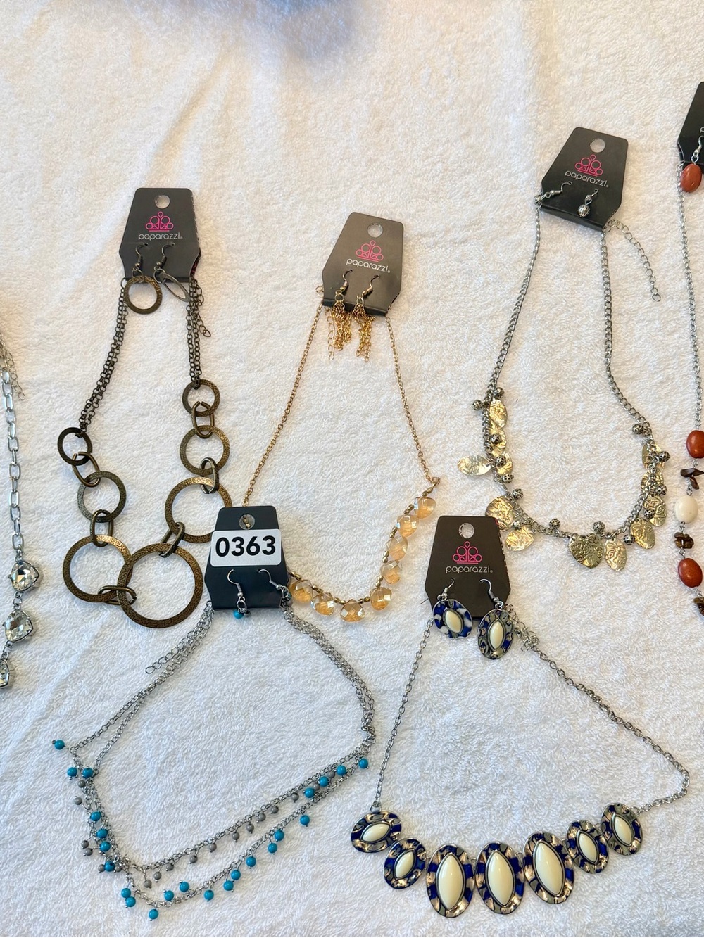 7 short necklaces and earrings.